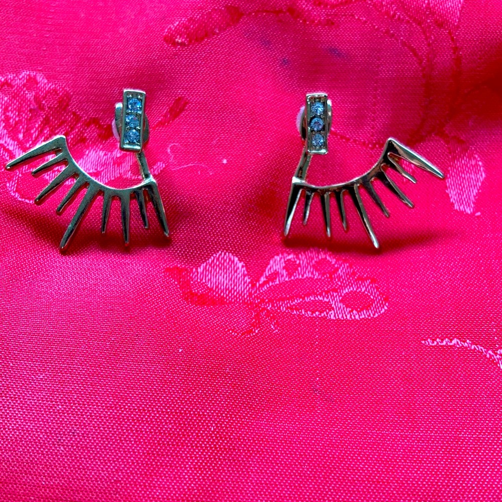 “BARNEYS” gold earrings with stones. Very cool on